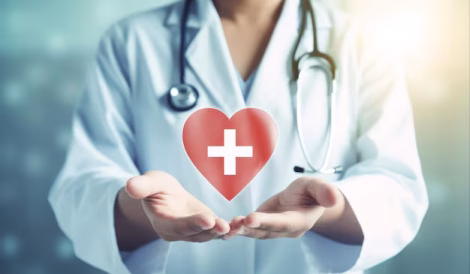 doctor-holds-heart-with-cross-it_1000124-264719